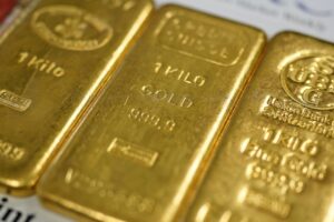 Gold prices hit all-time high on rising uncertainty, while U.S. stock futures little changed