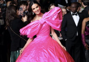 Demi Moore in Pink Silk Matieres Fecales at the “Paper Tiger” Premiere During the 79th Cannes Film Festival