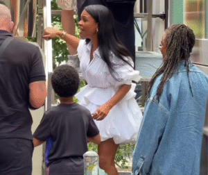 Nia Long Wore a Celine White Sculptural Shirt Dress and The Attico Ornella Dark Green Platform Stiletto Sandals at the Estée Lauder Pop-Up Bus in New York City